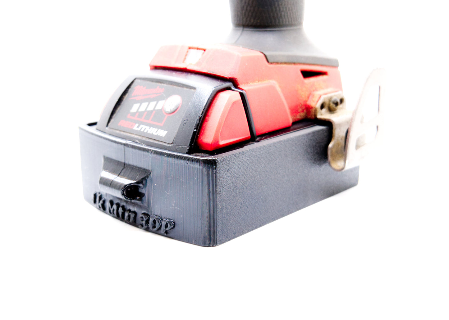 Milwaukee M18 Magnetic Battery Boot – Protective Case for M18 CP 2.0 Batteries - on battery - on tool - left front view
